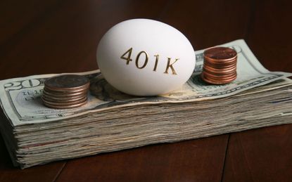 An egg with 401(k) written on it with a stack of money
