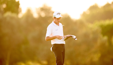 Felix Mory looks at his yardage book