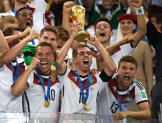 Germany captain Philipp Lahm lifts the World Cup trophy, July 2014