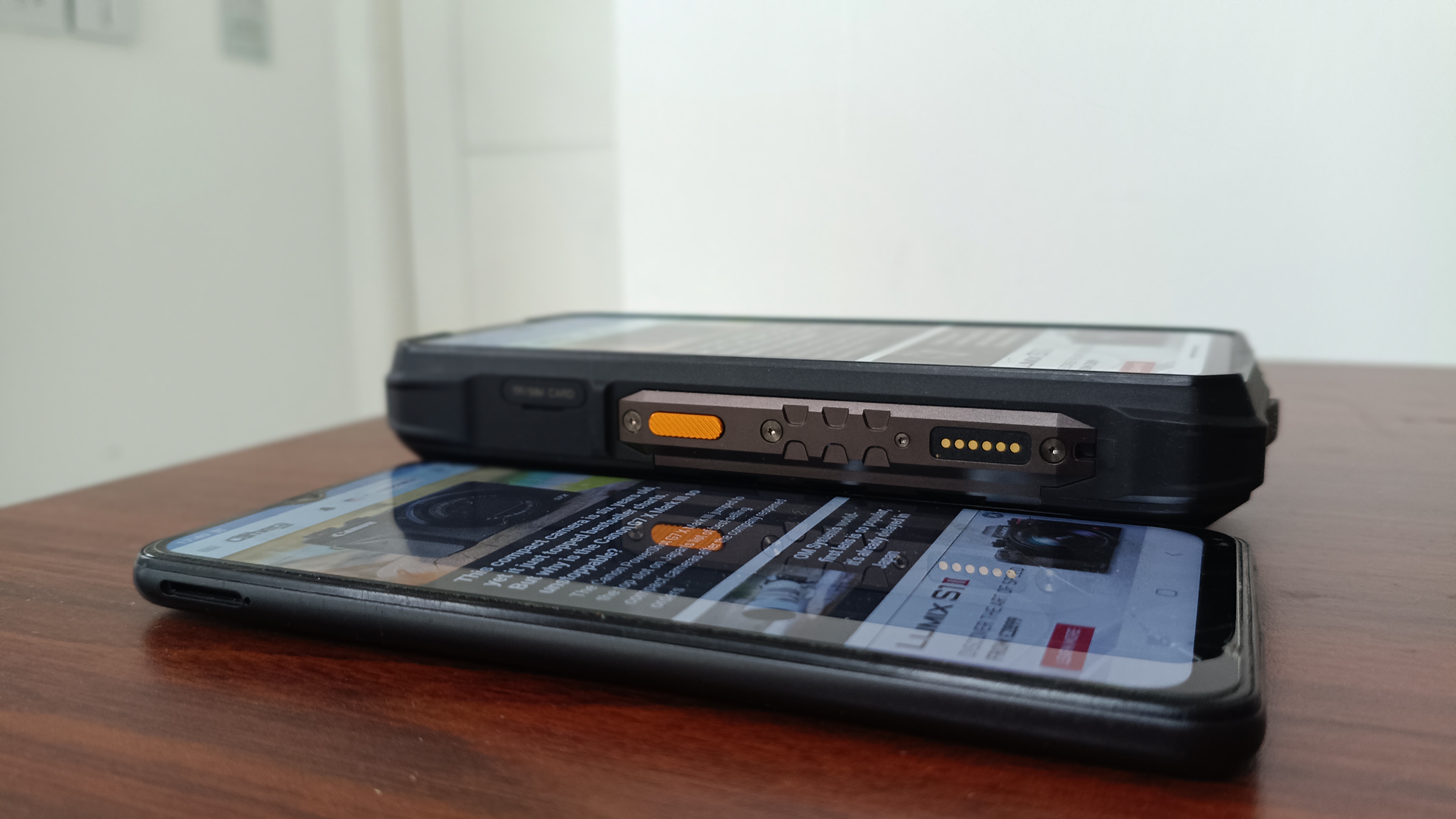 Ulefone Armor 29 Ultra phone on desk next to normal sized phone