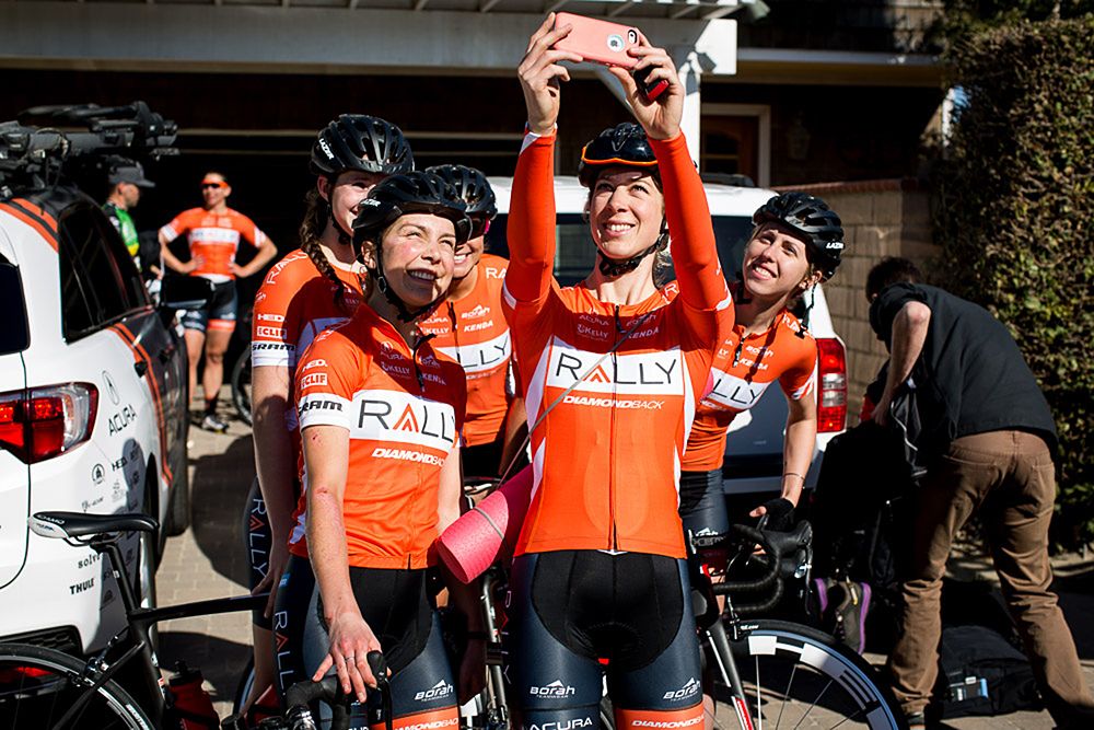 The women of Rally cycling pause for a team mandated selfie.