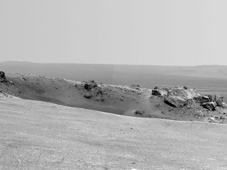 This image shows the Mars rover Opportunity's view of the Odyssey crater near the rim of the larger Endeavour crater on Mars.