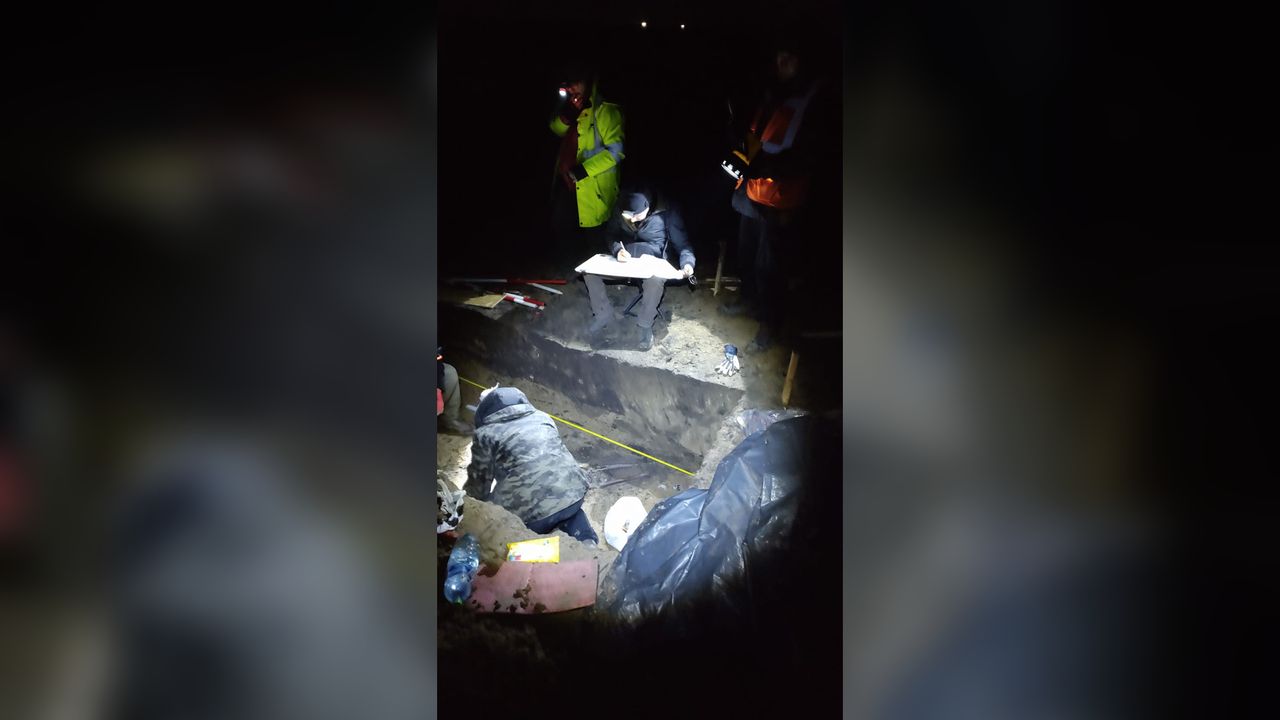 The tomb was discovered in bad weather and the excavation had to be completed with flashlights so the road construction project could go ahead.