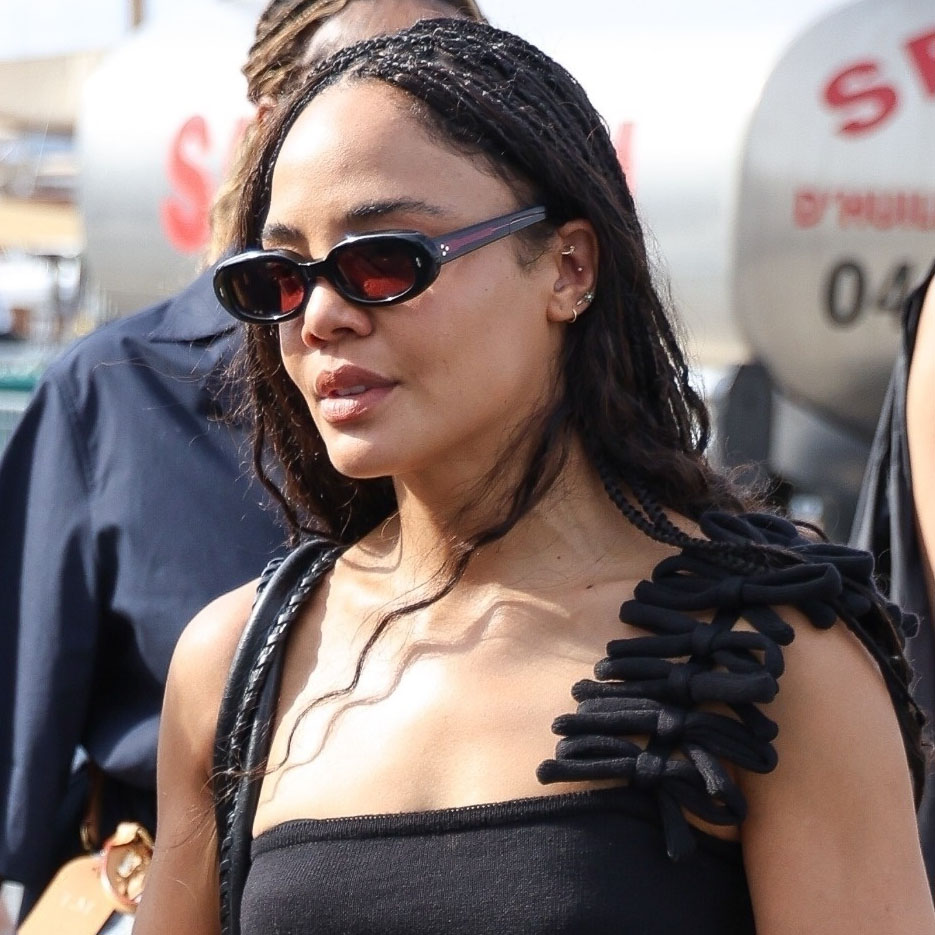 Tessa Thompson wearing a black tank to and black bubble hem skirt in saint tropez