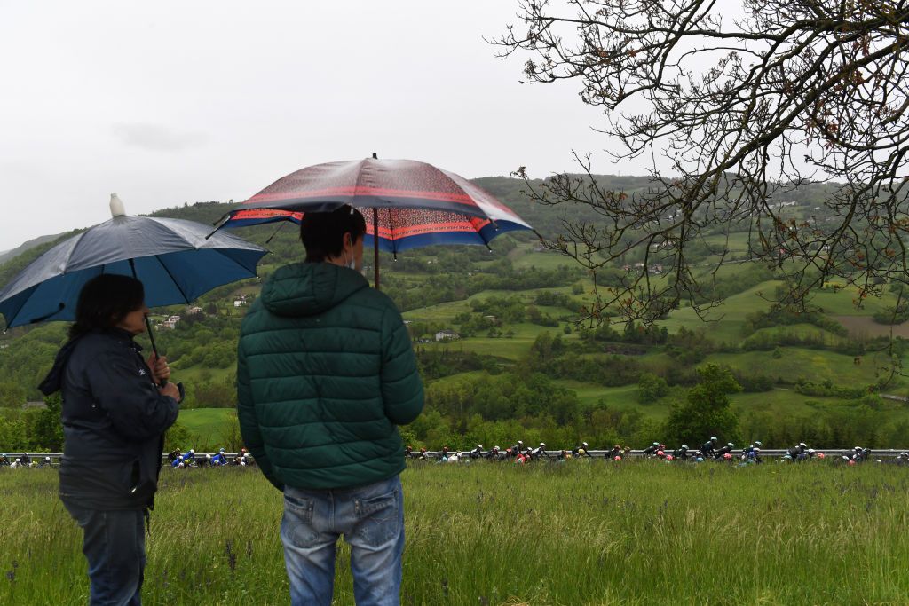 SESTOLA ITALY MAY 11 The Peloton during the 104th Giro dItalia 2021 Stage 4 a 187km stage from Piacenza to Sestola 1020m Landscape Fans Rain girodiitalia Giro UCIworldtour on May 11 2021 in Sestola Italy Photo by Tim de WaeleGetty Images