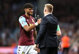 Tyrone Mings, left, celebrates victory with manager Dean Smith