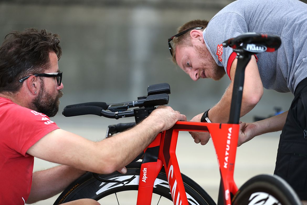 The Katusha-Alpecin mechanics look over the bikes