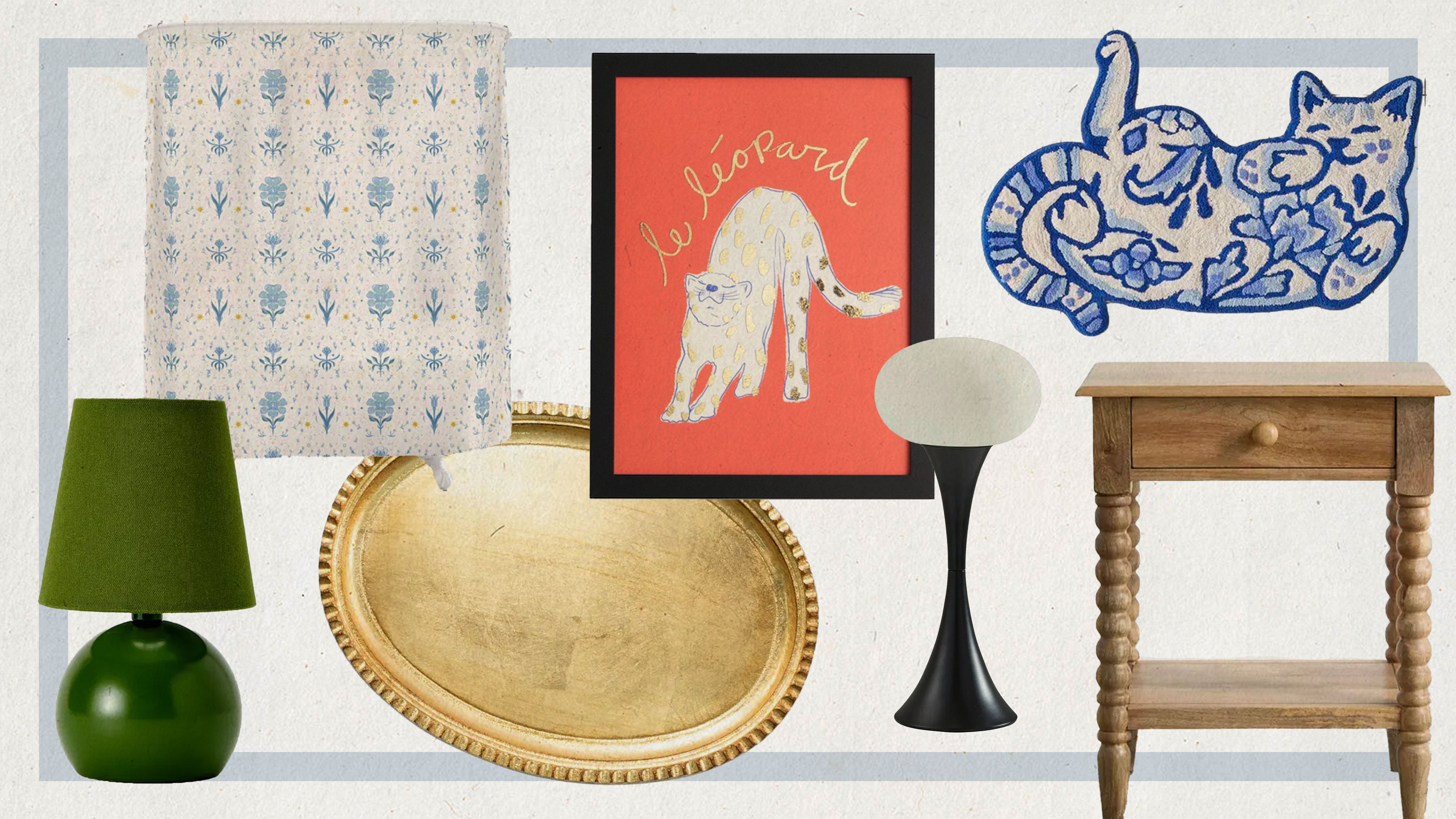 Leopard print artwork, a green lamp, a golden wooden tray, a shower curtain, a cat rug, a wooden nightstand, and a black table lamp. 
