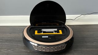 The Miele Scout RX3 Vision HD with its lid open and the dust box visible