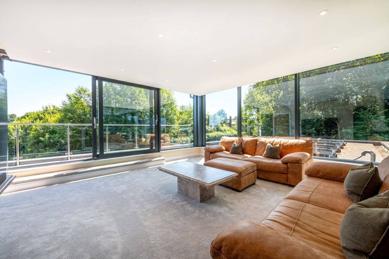 A rooftop lounge has 360 degree bifold glass doors