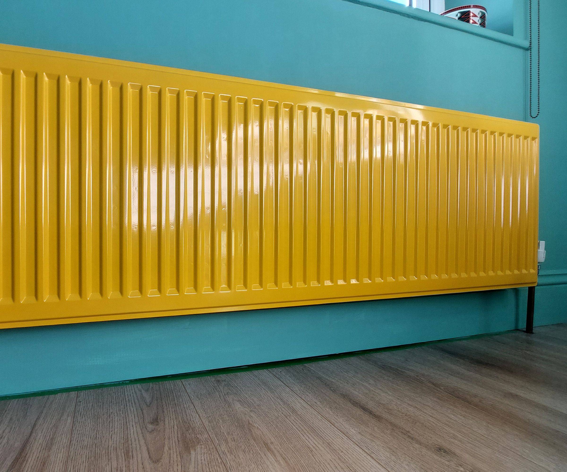 yellow radiator on blue wall