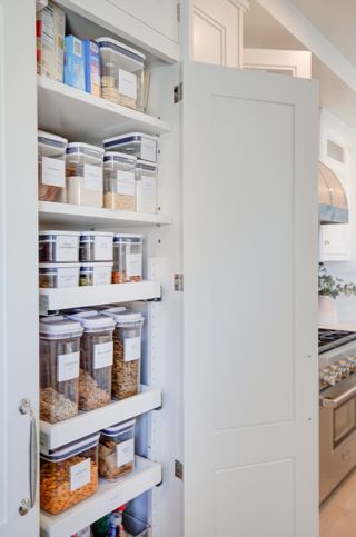 a pantry with plastic storage containers