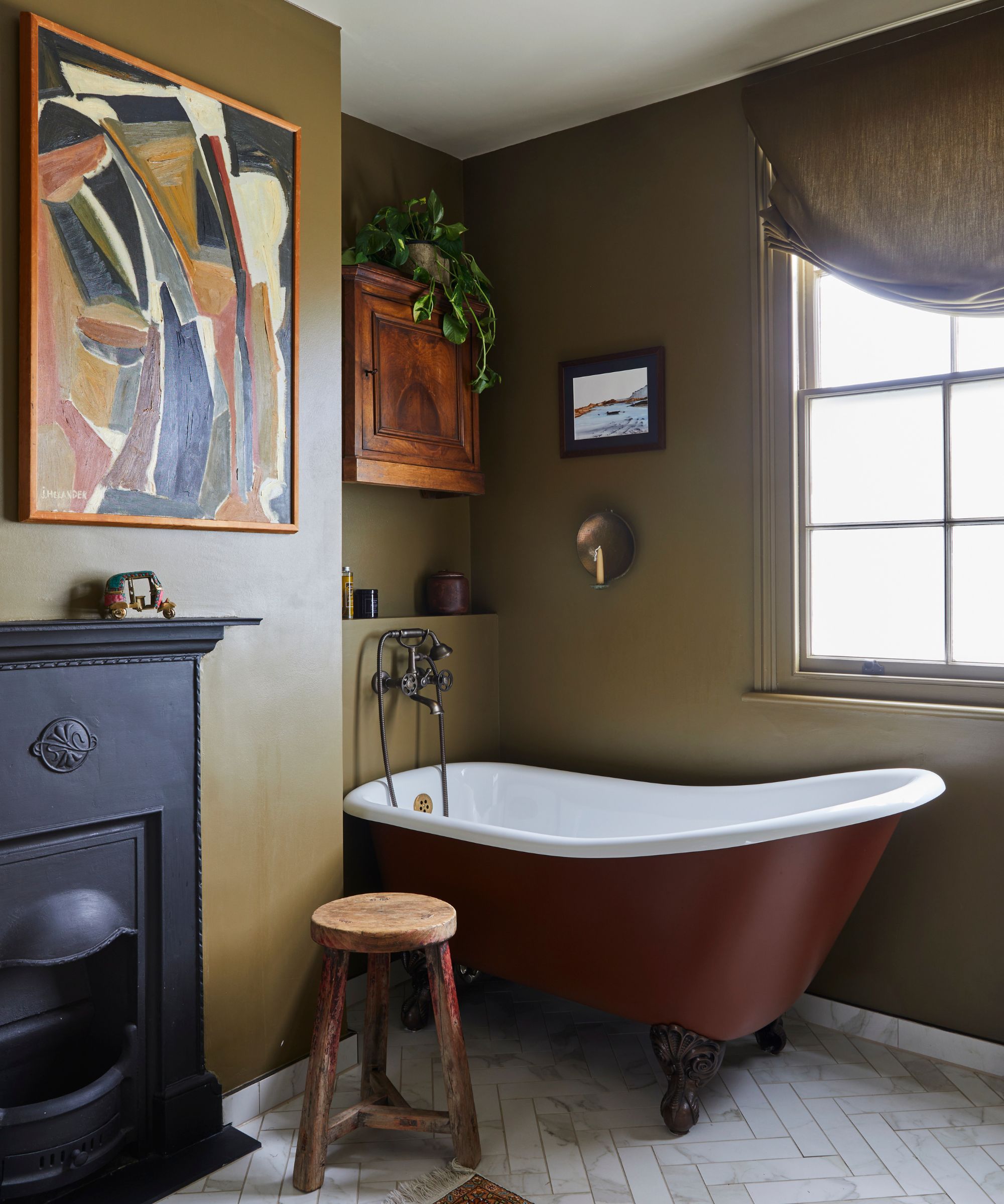 brown bathroom with a freestanding bath