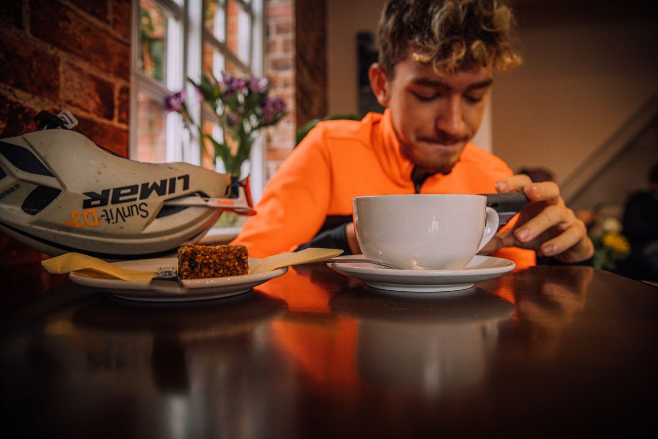 Image shows a rider at a cafe.