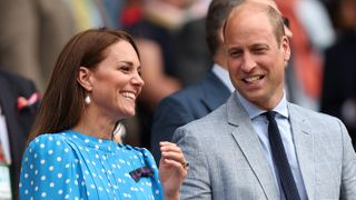 Catherine, Duchess of Cambridge and Prince William, Duke of Cambridge watch from the Royal Box at Wimbledon