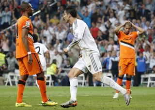 Cristiano Ronaldo celebrates after scoring a late equaliser for Real Madrid against Valencia in 2014.