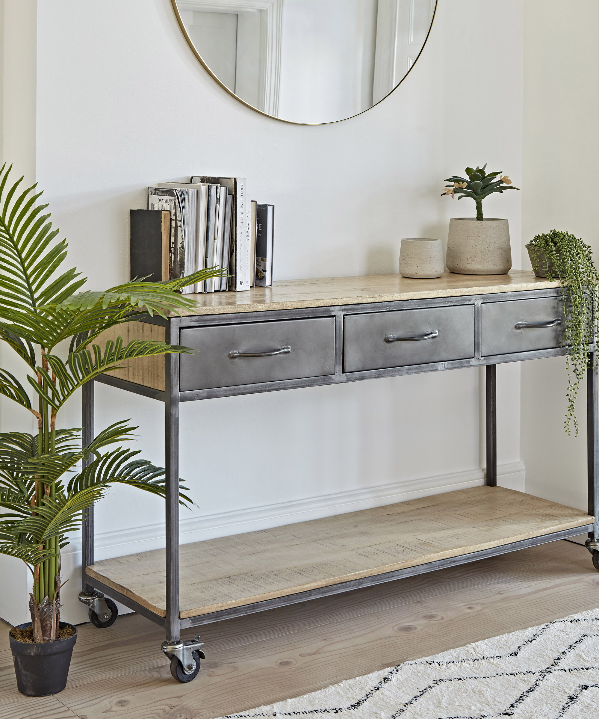 Hallway console table with wheels by Cox and Cox