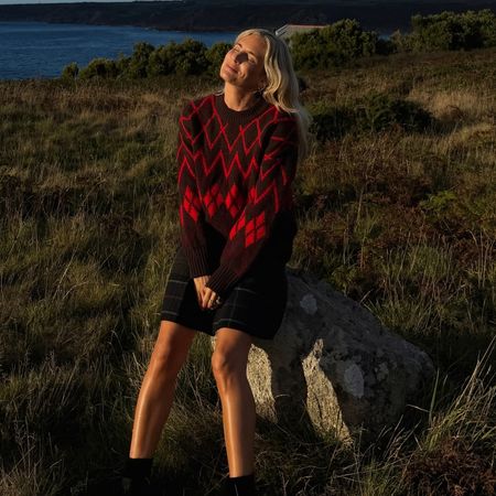 How to wear a kilt skirt 2026: Lucy Williams wears a statement knit, kilt and ankle boots