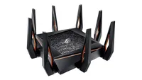 Asus GT-AX11000 ROG Rapture wireless router shown in black and grey colourway and on a white background