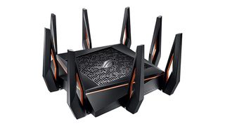 Asus GT-AX11000 ROG Rapture wireless router shown in black and grey colourway and on a white background