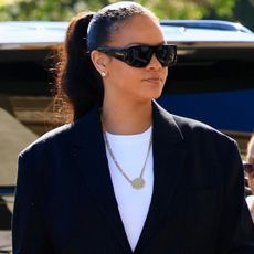 Rihanna was spotted wearing an anti-Rihanna capsule wardrobe outfit, featuring jeans, a white T-shirt, and a blazer.