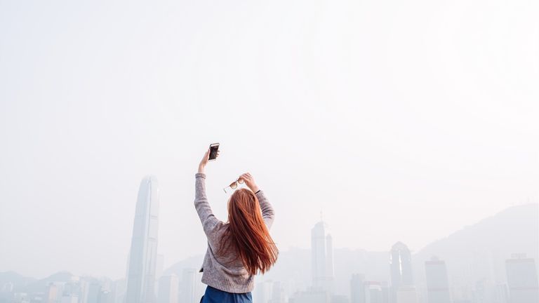 Woman taking a selfie with a mobile phone