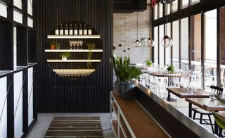 A stripped-back aesthetic is the consistent theme through all three approaches in a space where timbers sit alongside dark woods and bare bricks.