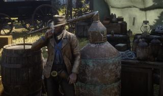 Red Dead Redemption 2 Arthur Morgan smoking near moonshine equipment