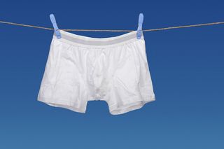 Men's underwear hanging from a clothesline.