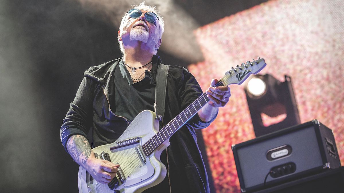 Reeves Gabrels performs onstage