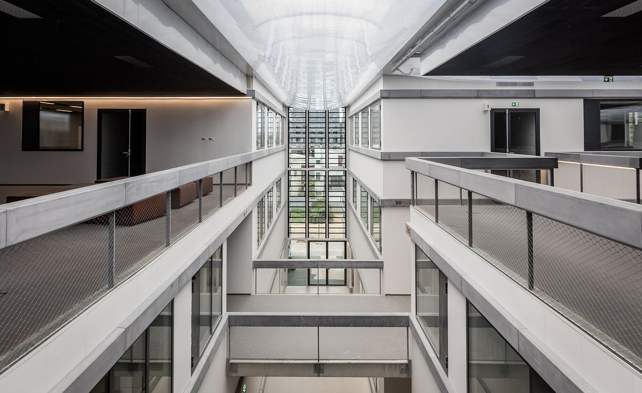 White interior with multiple levels and overlooking balconies