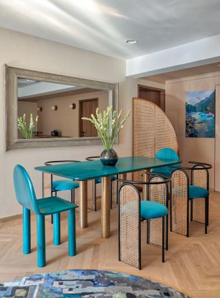 A dining room with a blue table top