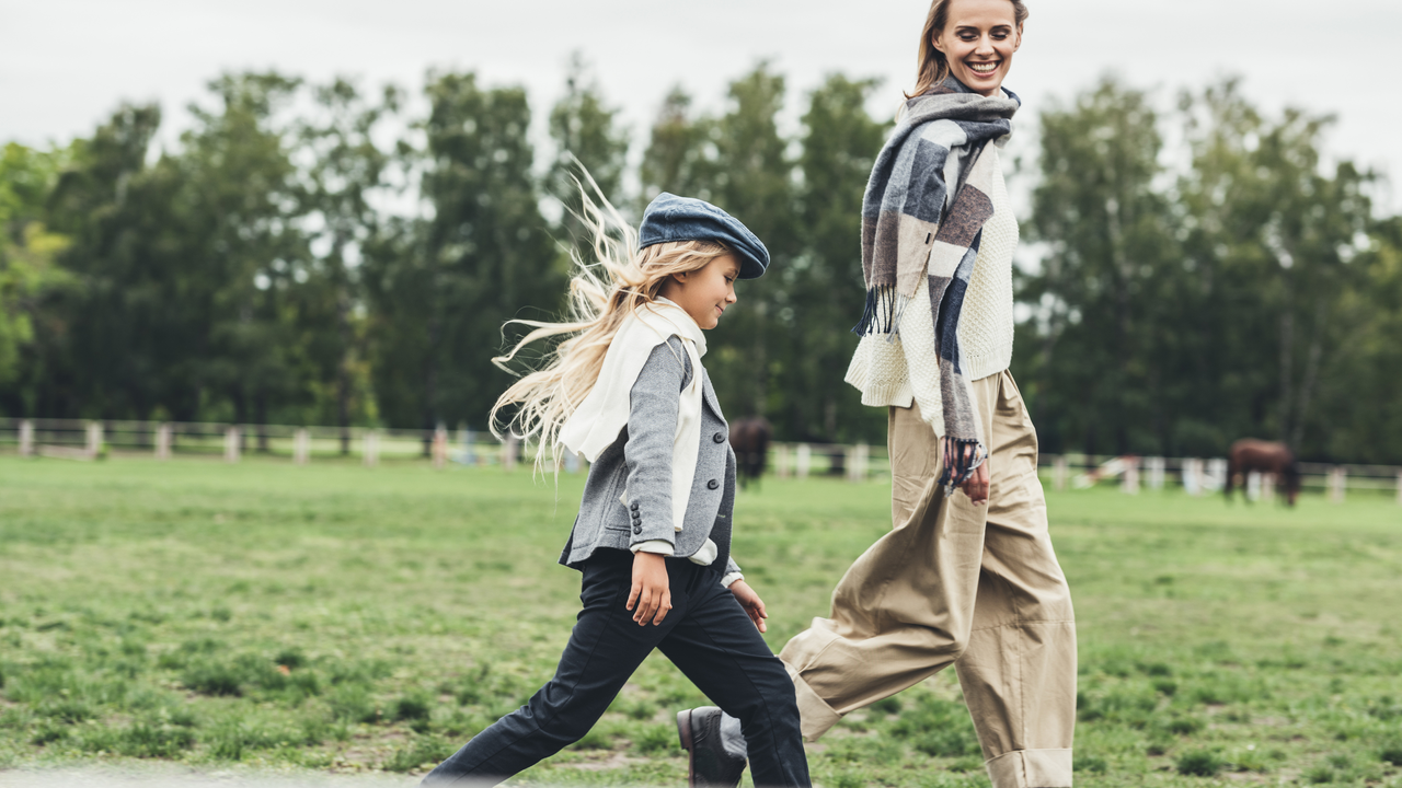 mother and daughter walking outside