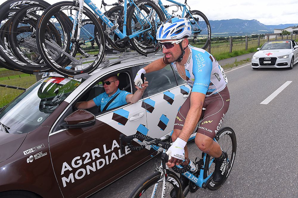 Sebastian Turgot at the team car during stage 4 at the Tour de Suisse