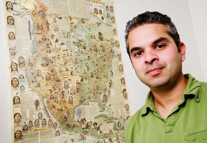 Ripan Malhi with a map behind him