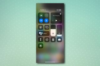 An iPhone control center screen, demonstrating how to mirror an iPhone screen to PC