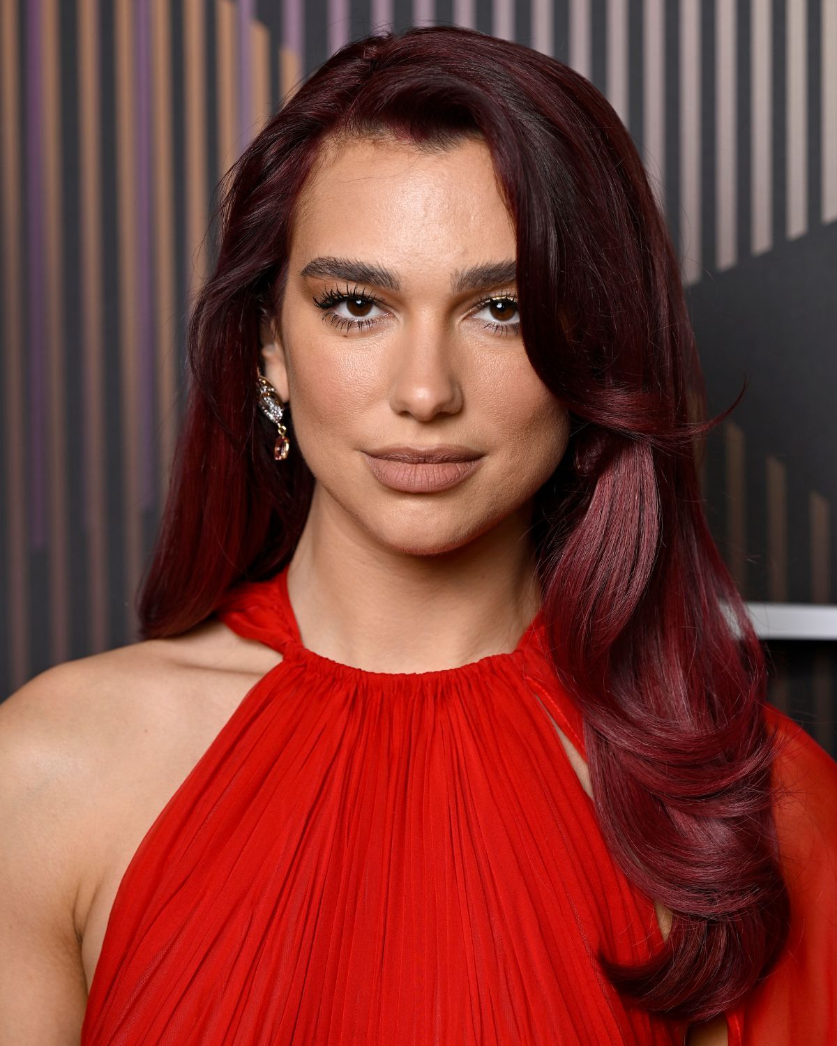 Dua Lipa sharing sides at the 2024 BAFTAs