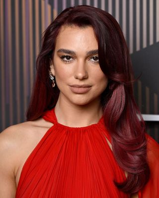 Dua Lipa with a side parting at the BAFTAs 2024