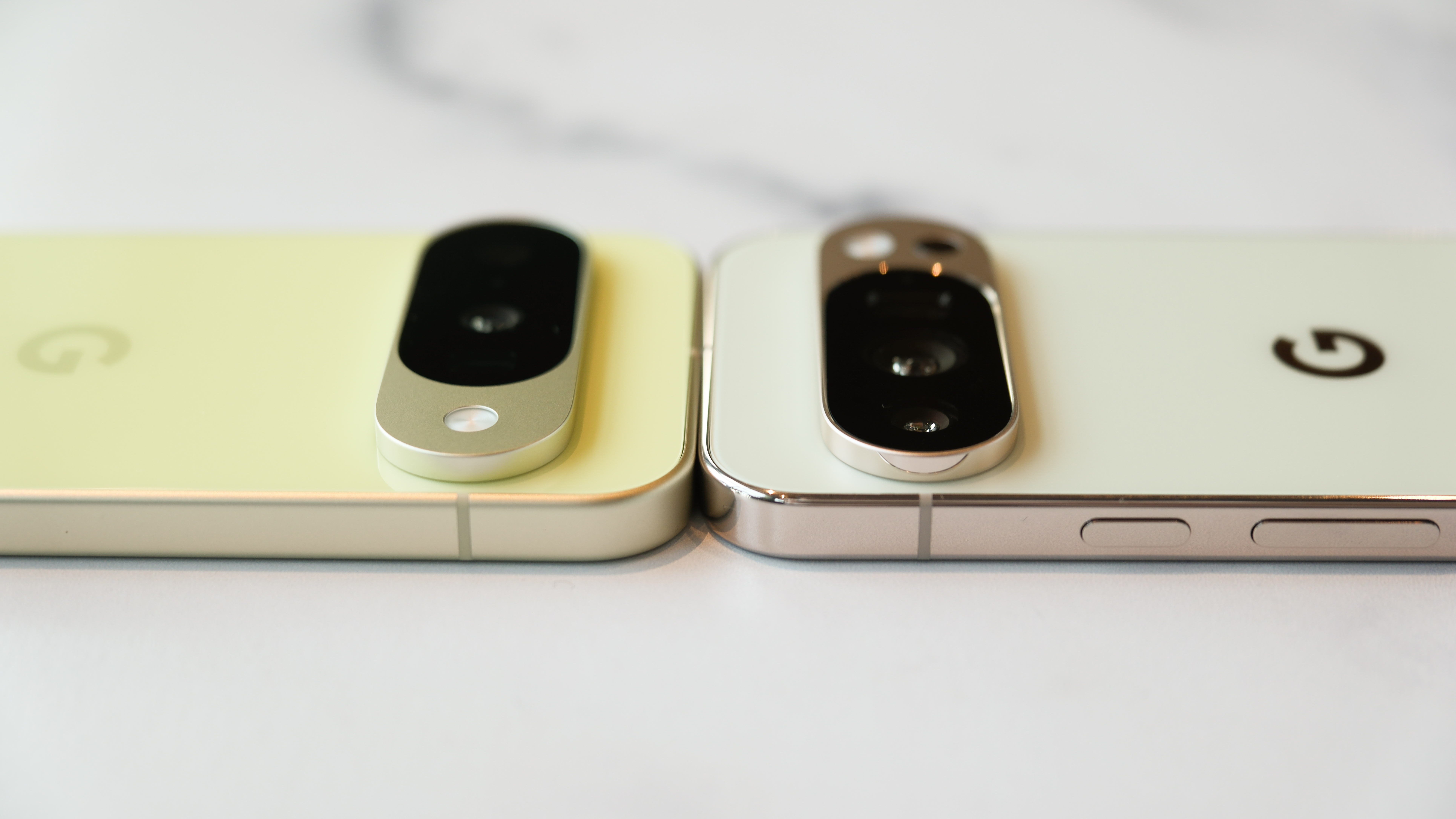 Google Pixel 10 and Pixel 10 Pro top to top showing camera bumps