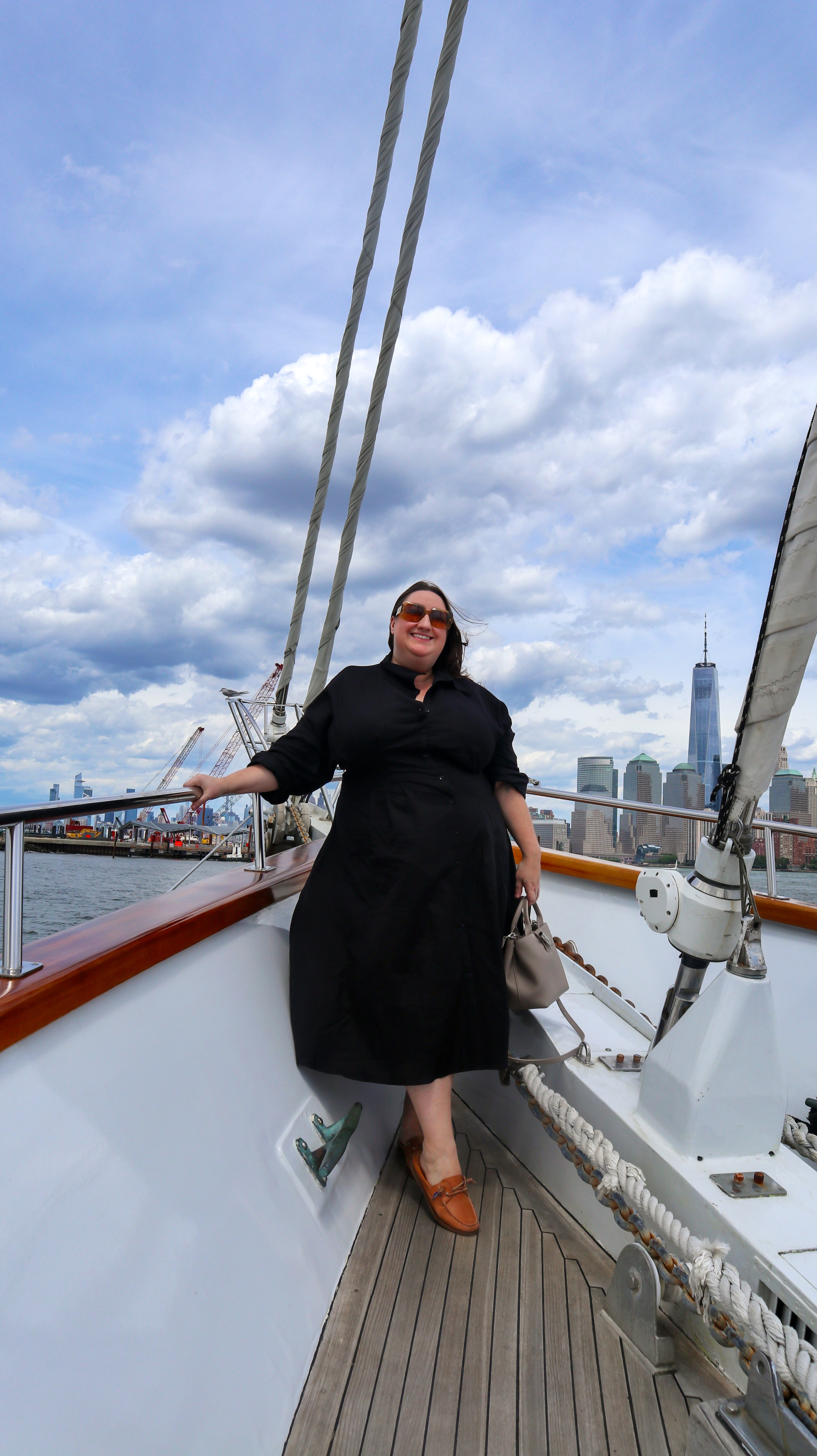 Sarah Chiwaya styling a black linen dress with boat shoes