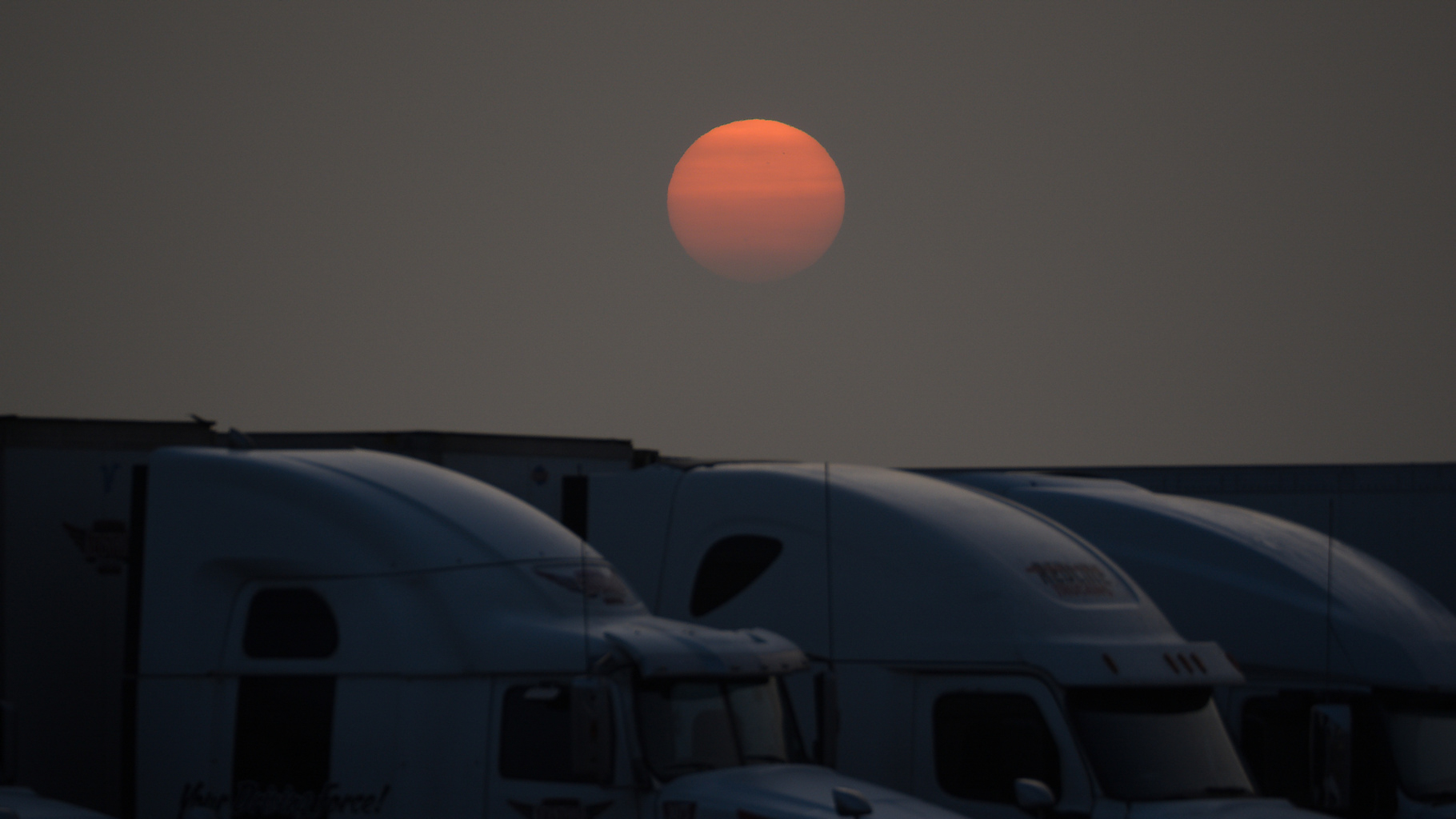 Red sun during wildfires in Canada