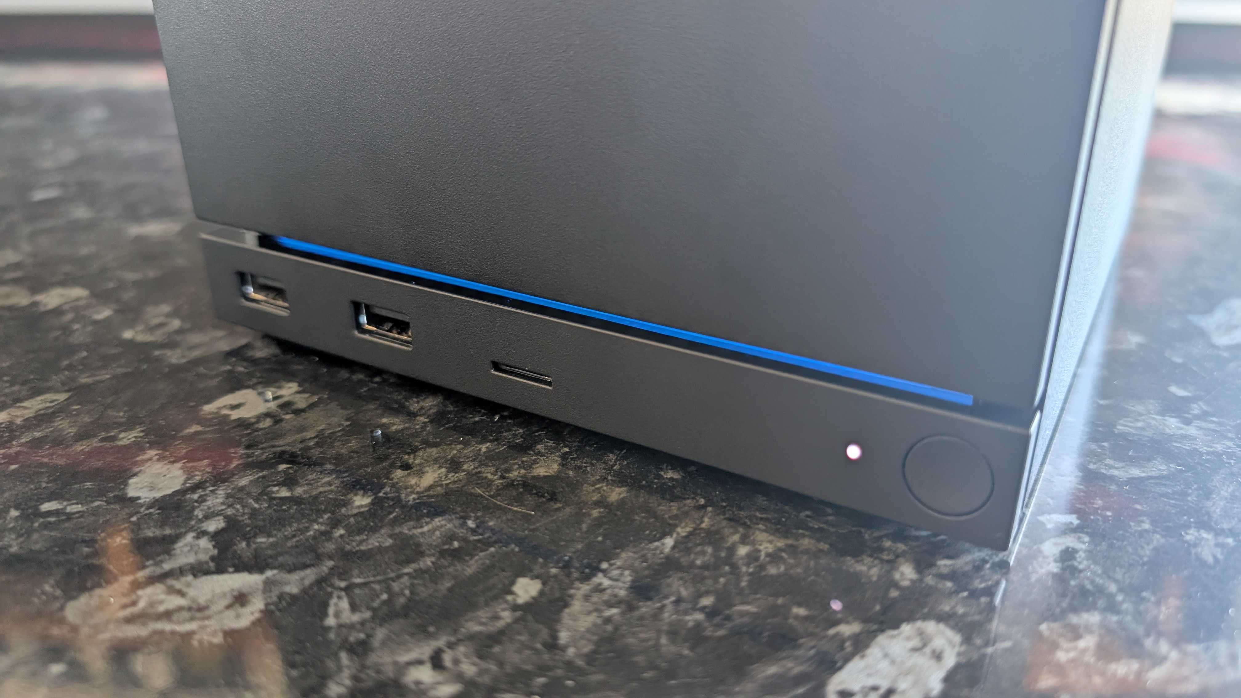 The Valve Steam Machine, pictured on a dark marble worktop.