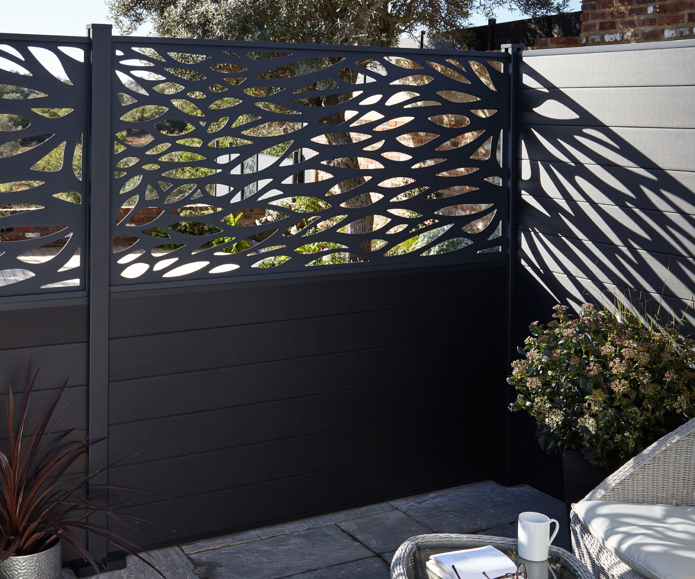 black composite fence with decorative top panel