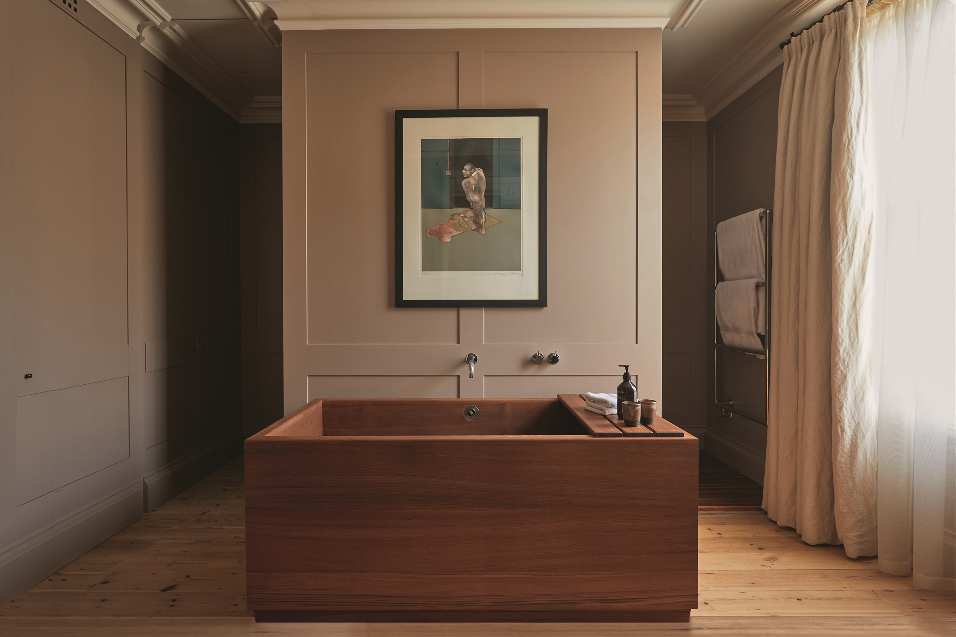 a timber japanese soaking tub in traditional paneled bathroom