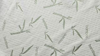 The close up of the surface of the Utopia Bedding Bamboo Mattress Protector showing the green leaf motif