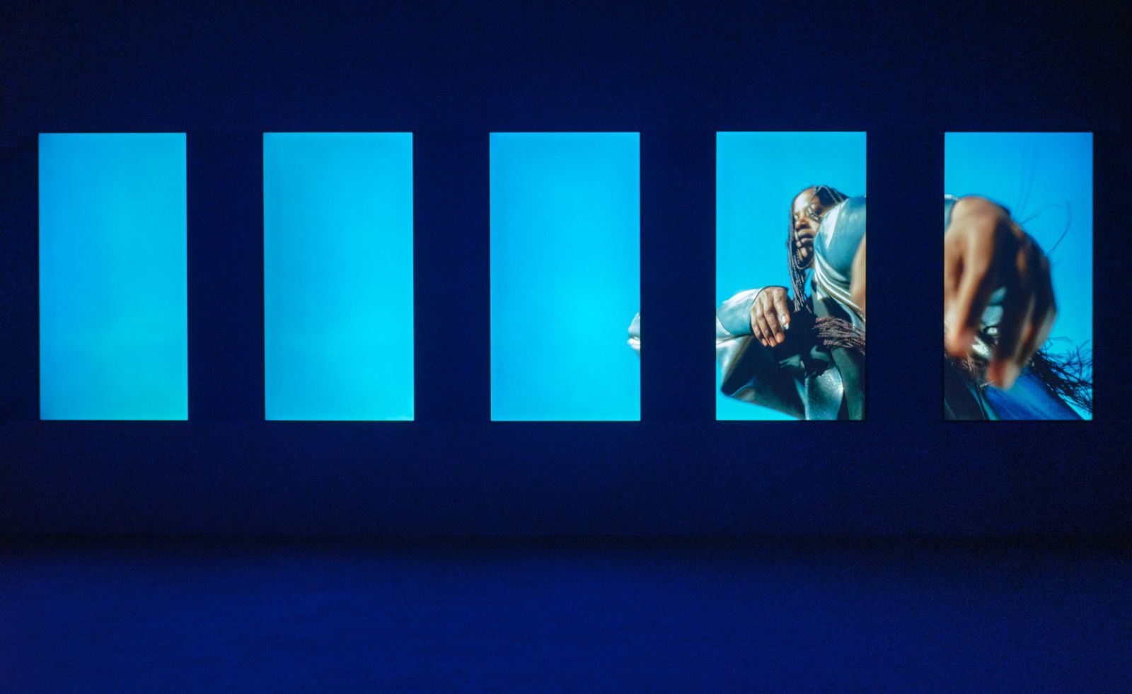 dark installation view of film on big screen