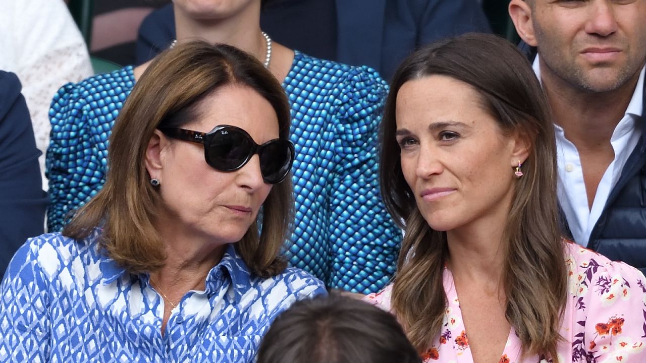 Carole Middleton and Pippa Middleton talk to each other as they attend day thirteen of the Wimbledon Tennis Championships in 2019