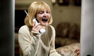 drew barrymore screaming on the phone in a still from Scream