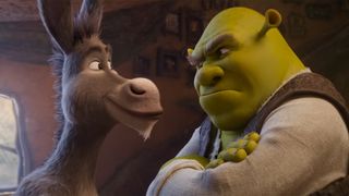 Shot from Shrek 5 teaser trailer of Shrek frowning at a smiling Donkey