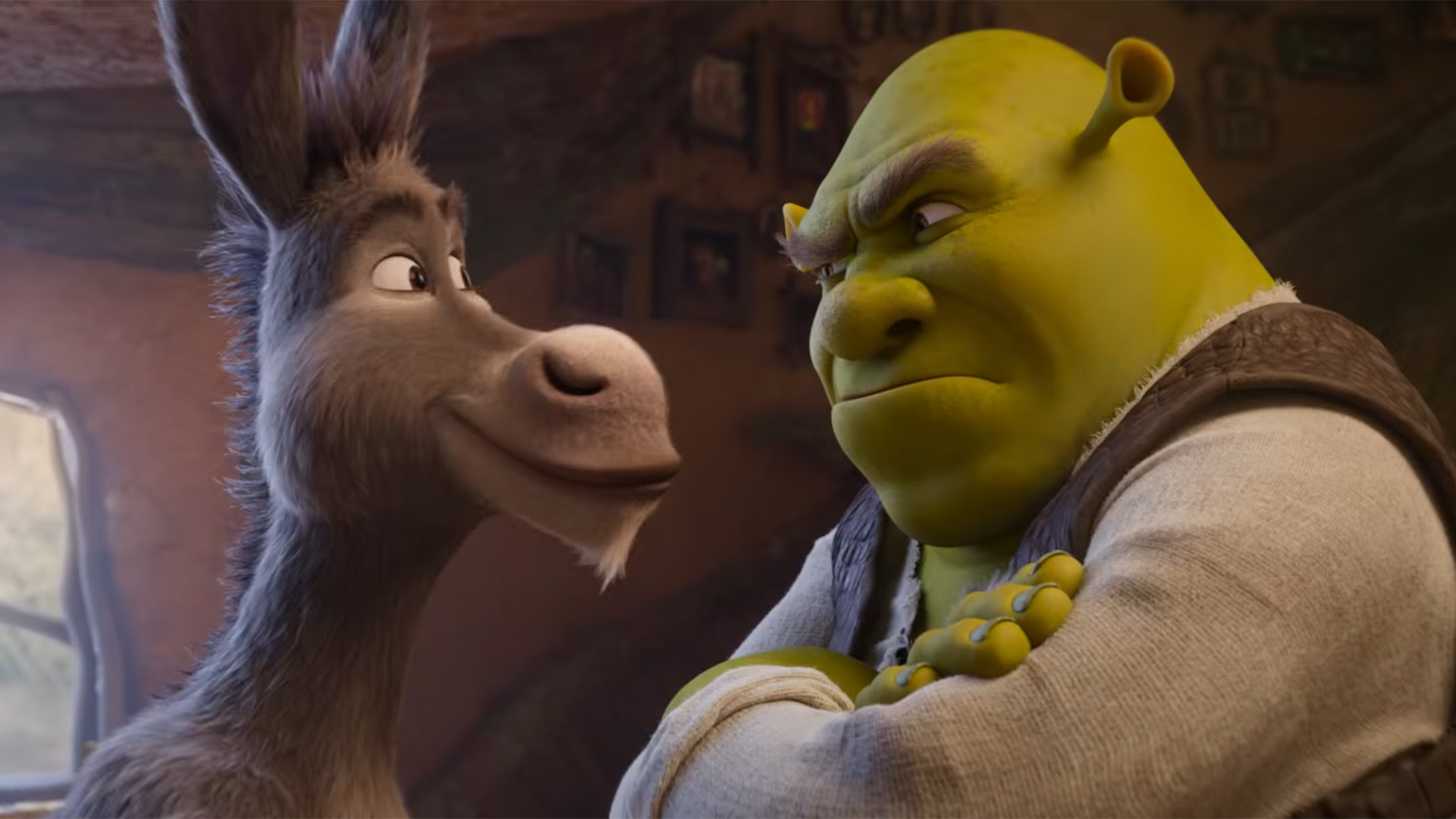 Shot from Shrek 5 teaser trailer of Shrek frowning at a smiling Donkey